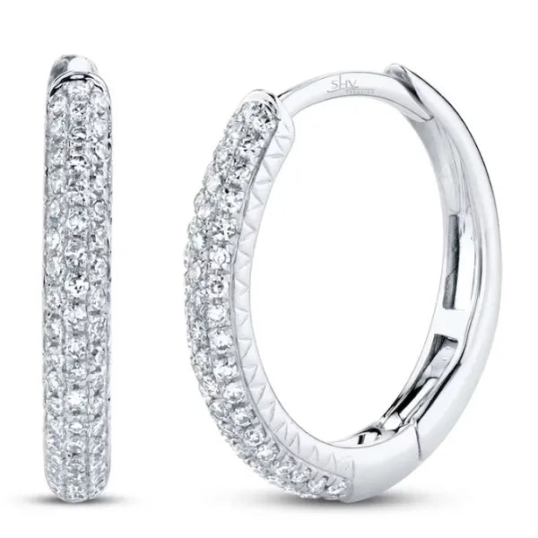 Shy Creation Huggies Earrings in 14K Gold with Round Diamonds. These earrings offer Hinged Huggie closure.