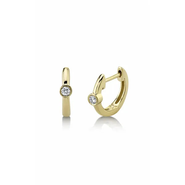Shy Creation Huggies Earrings in 14K Yellow Gold with Round Diamonds. These earrings offer Hinged Huggie closure.