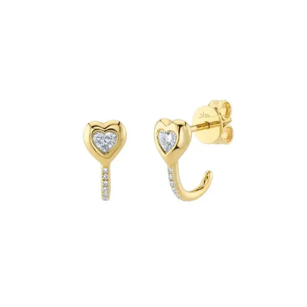 Shy Creation Huggies Earrings in 14K Yellow Gold with Round Diamonds. These earrings offer Hinged Huggie closure.