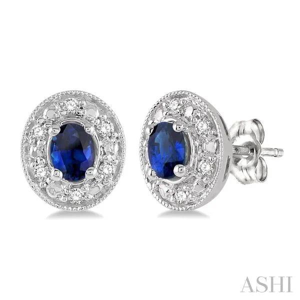 Ashi Stud Earrings in 14K White Gold with Oval Diamonds, Sapphire in a Prong design. These earrings offer total weight 0.10 ctw, Push Back closure.