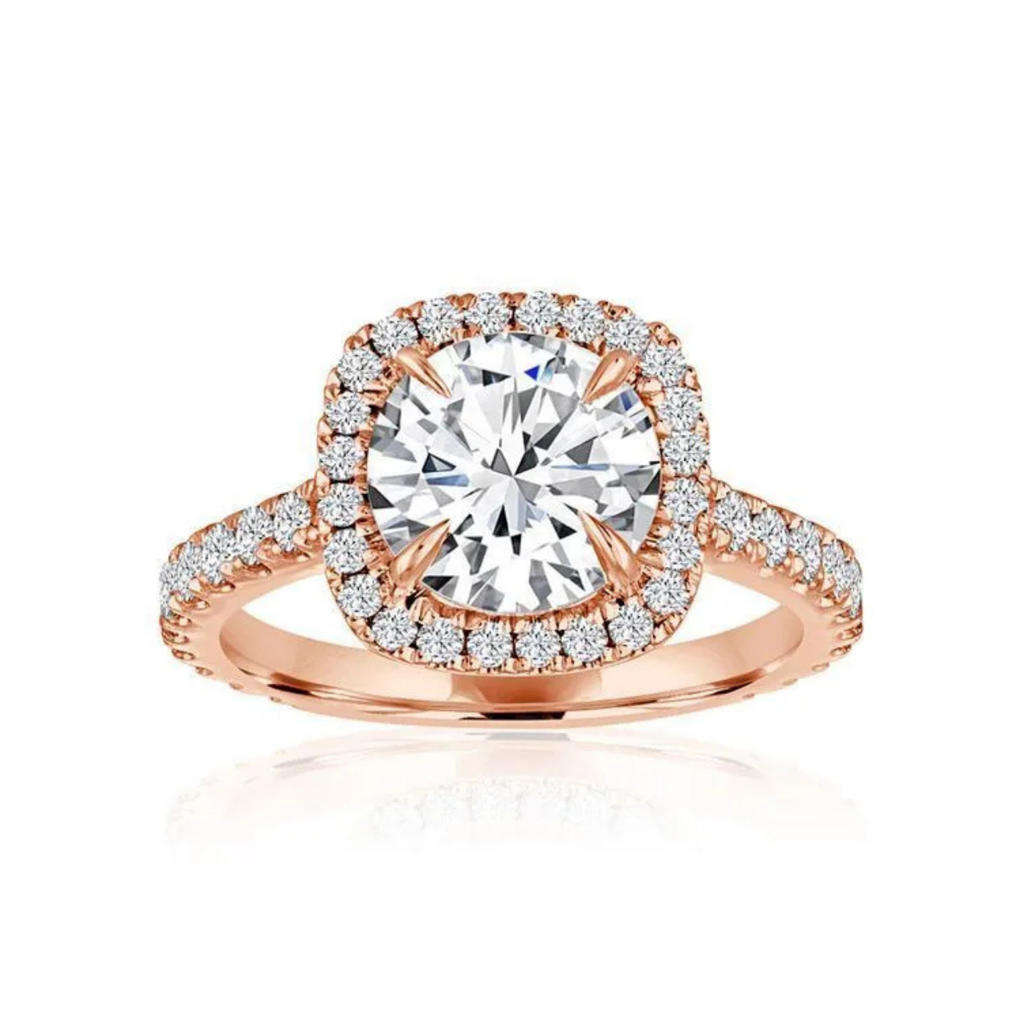 Crafted in 14K Rose' Gold and a halo setting featuring a round, cushion center diamond of 0.6 carats.