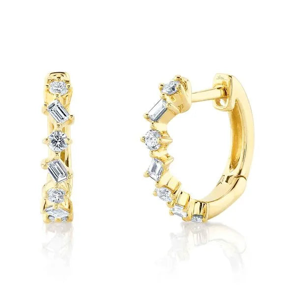 Shy Creation Huggies Earrings in 14K Yellow Gold with Round Diamonds. These earrings offer Hinged Huggie closure.