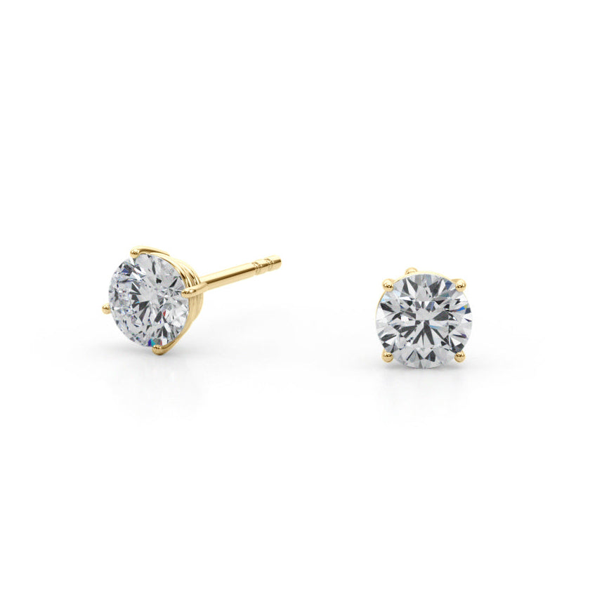 Pair of yellow gold diamond stud earrings on a white background