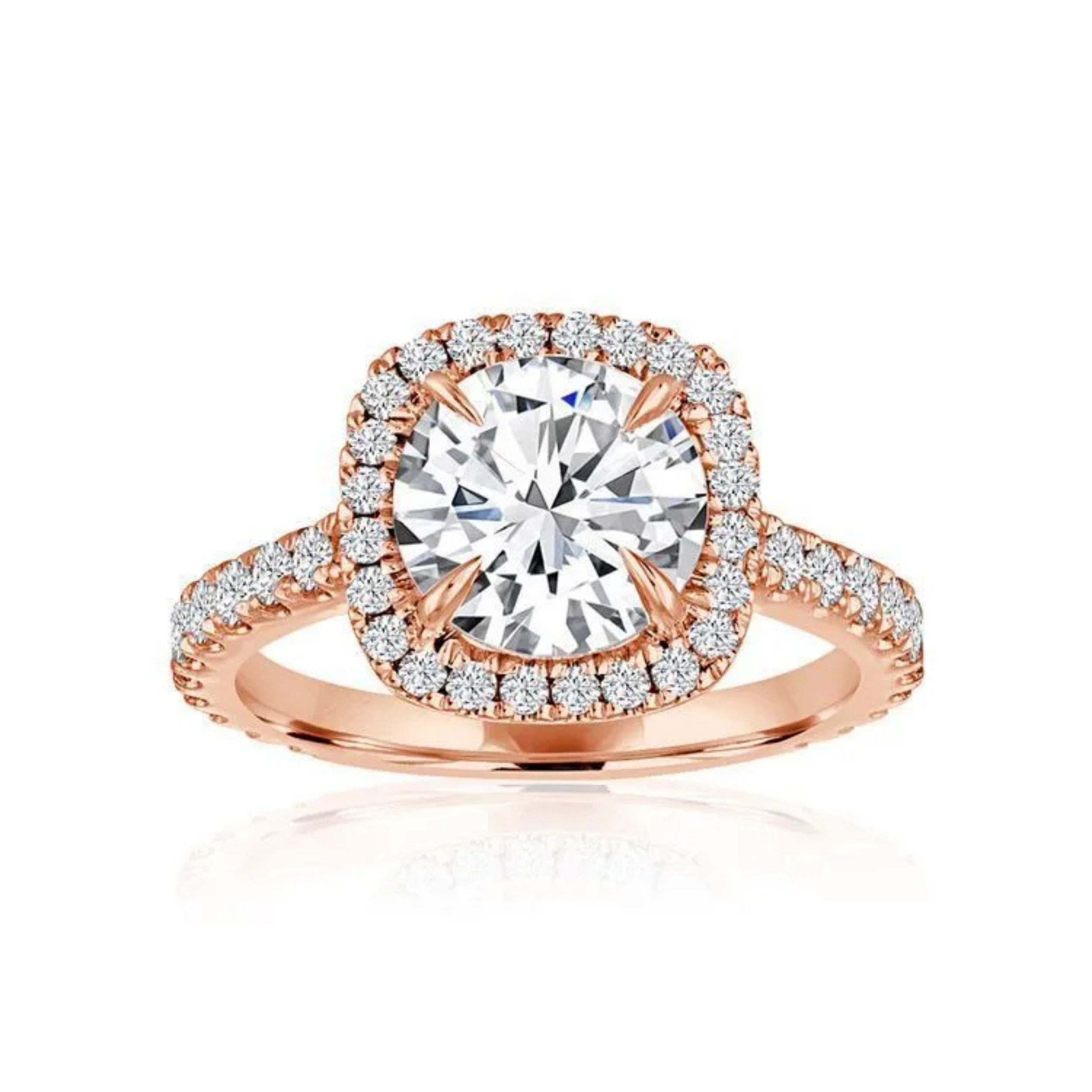 Crafted in 14K Rose' Gold and a halo setting featuring a round, cushion center diamond of 0.6 carats.