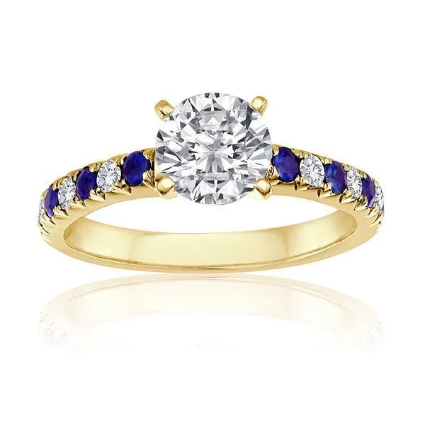 This engagement ring is crafted in 14K Yellow Gold. It showcases a center diamond of approximately 0.1 carats.