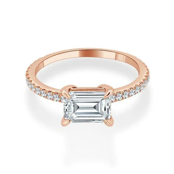 This engagement ring is crafted in 14K Rose' Gold. It showcases a center diamond of approximately 0.25 carats.