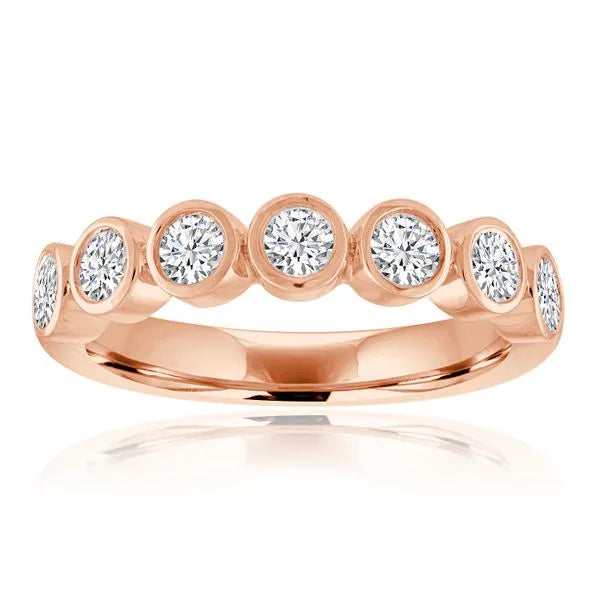 This gold 14K Rose' Gold rose wedding band features a twisted style with a twisted setting. The design is accented with diamonds totaling about 0.056 carats.