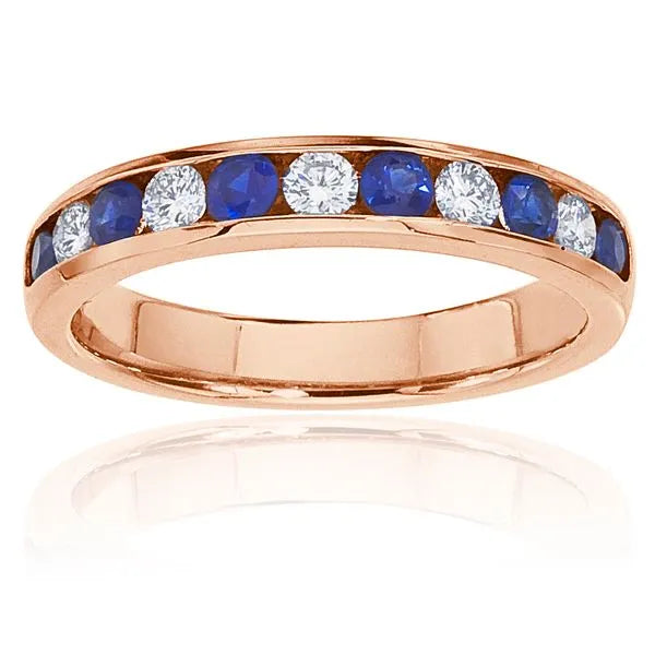 This gold 14K Rose' Gold rose wedding band features a channel style with a channel setting. The design is accented with diamonds totaling about 0.1 carats.