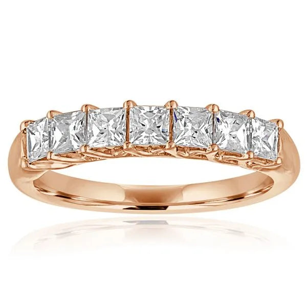 This gold 14K Rose' Gold rose wedding band features a wedding band style with a wedding band setting. The design is accented with diamonds totaling about 0.5 carats.