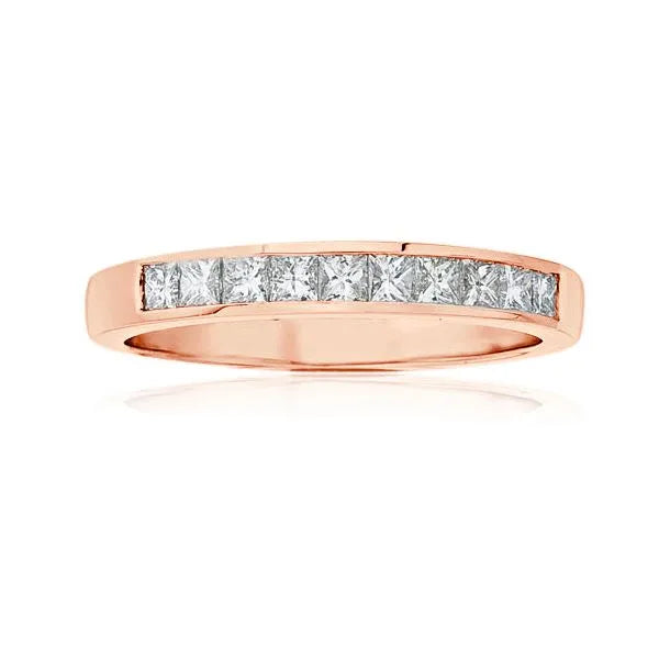 This gold 14K Rose' Gold rose wedding band features a channel style with a channel setting. The design is accented with diamonds totaling about 0.075 carats.