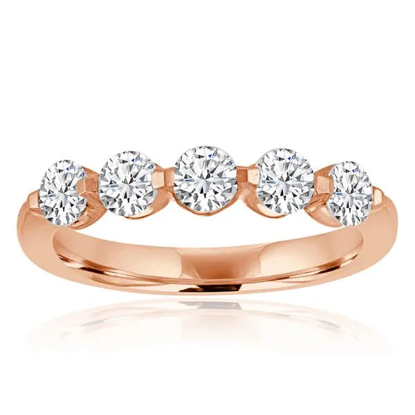 This gold 14K Rose' Gold rose wedding band features a wedding band style with a wedding band setting. The design is accented with diamonds totaling about 0.071 carats.