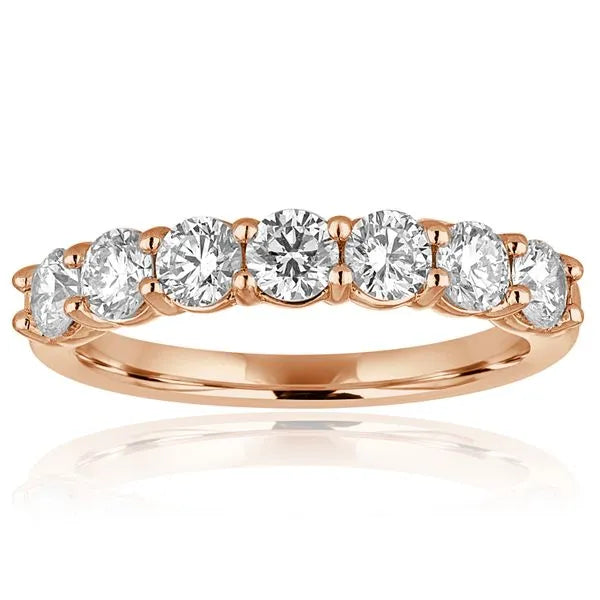 This gold 14K Rose' Gold rose wedding band features a anniversary style with a anniversary setting. The design is accented with diamonds totaling about 0.5 carats.