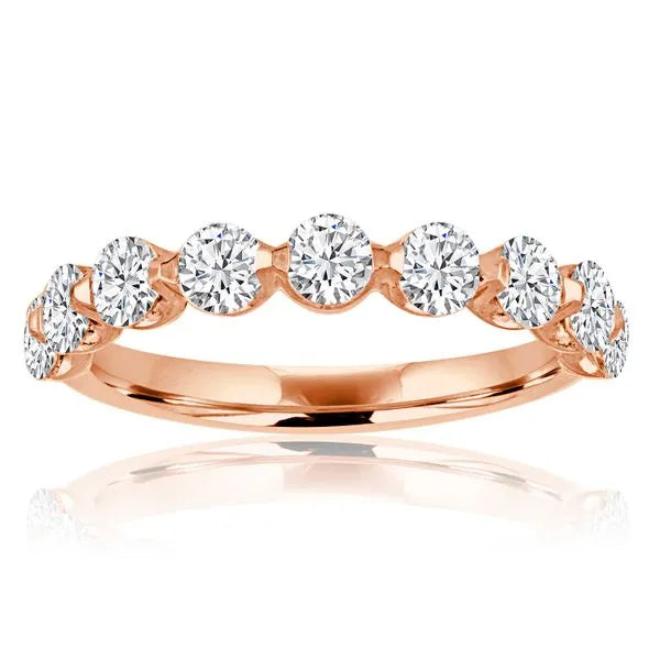 This gold 14K Rose' Gold rose wedding band features a wedding band style with a wedding band setting. The design is accented with diamonds totaling about 0.1 carats.