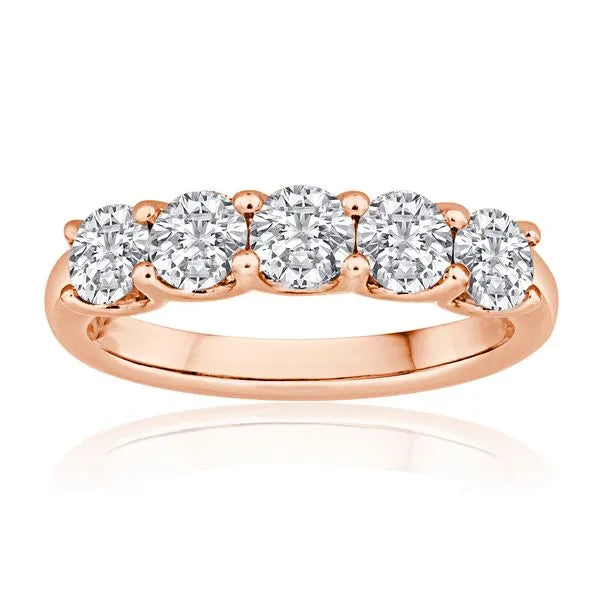 This gold 14K Rose' Gold rose wedding band features a wedding band style with a wedding band setting. The design is accented with diamonds totaling about 0.39 carats.