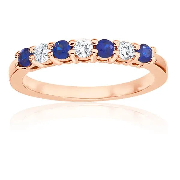 This gold 14K Rose' Gold rose wedding band features a twisted style with a twisted setting. The design is accented with diamonds totaling about 0.2 carats.