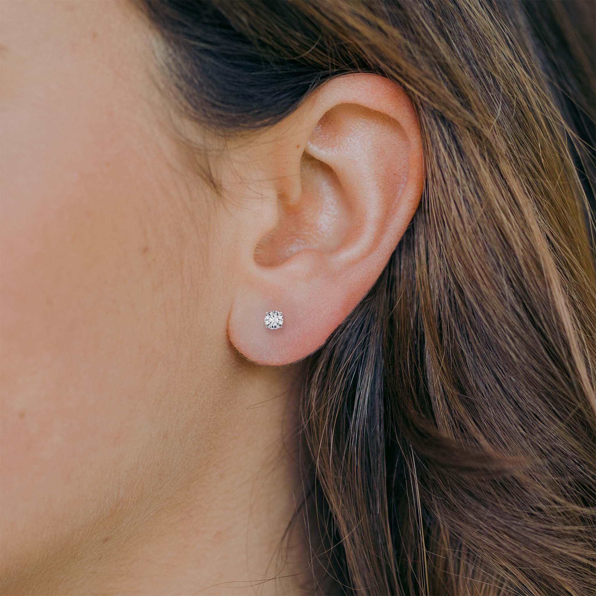 Diamond studs on ear: 1/2 CTW