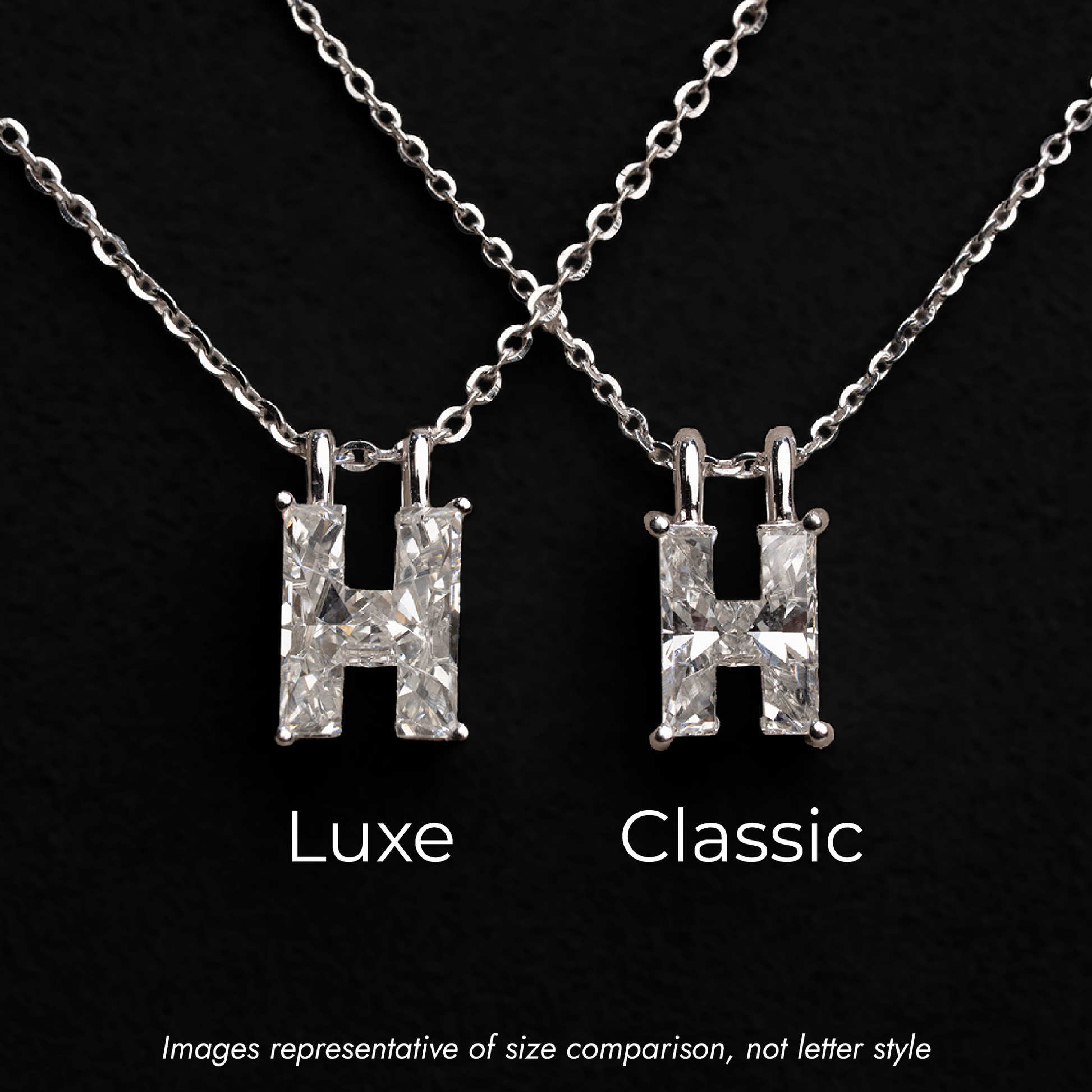 Side by side single diamond cut letter H's on white gold necklace chains on black background, a larger and smaller size are represented with the larger being labeled as Luxe and the smaller labeled as Classic.  Subtext reads,"Images representative of size comparison, not letter style".