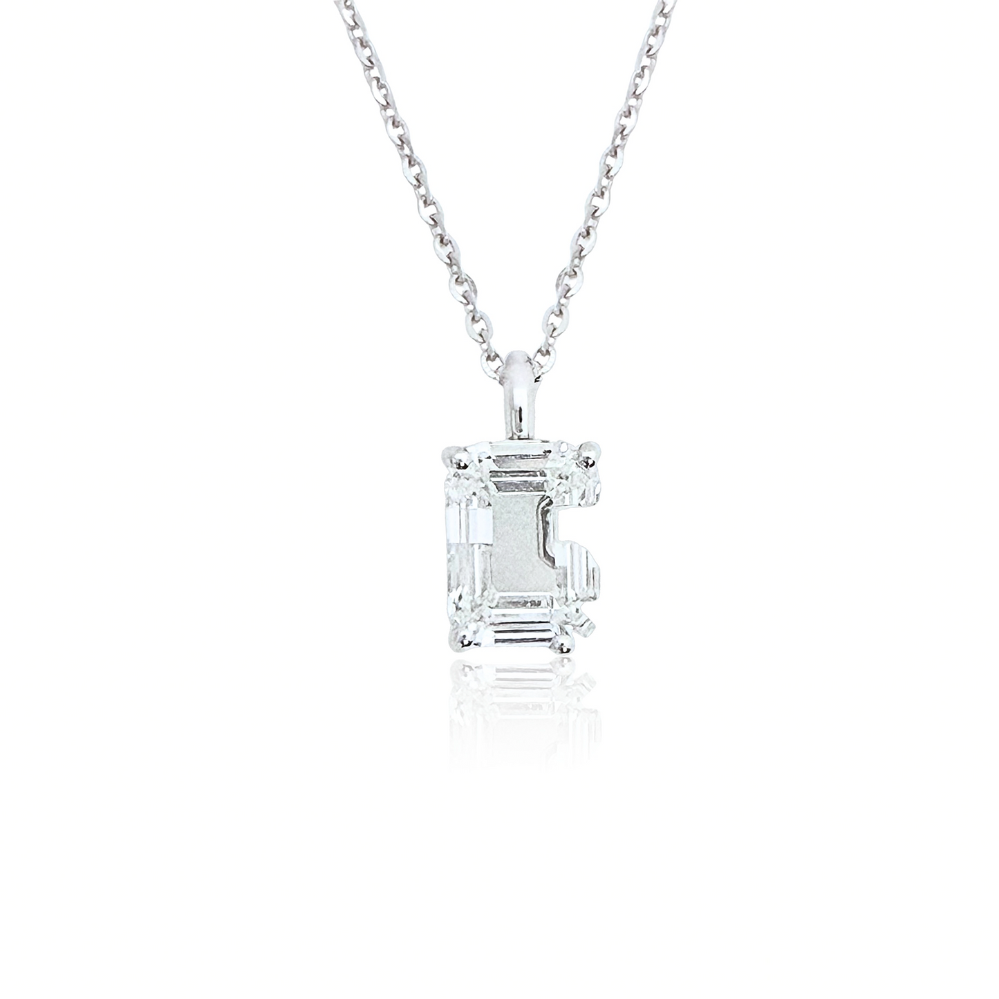 White gold necklace with a 'G' shaped diamond pendant on a white background