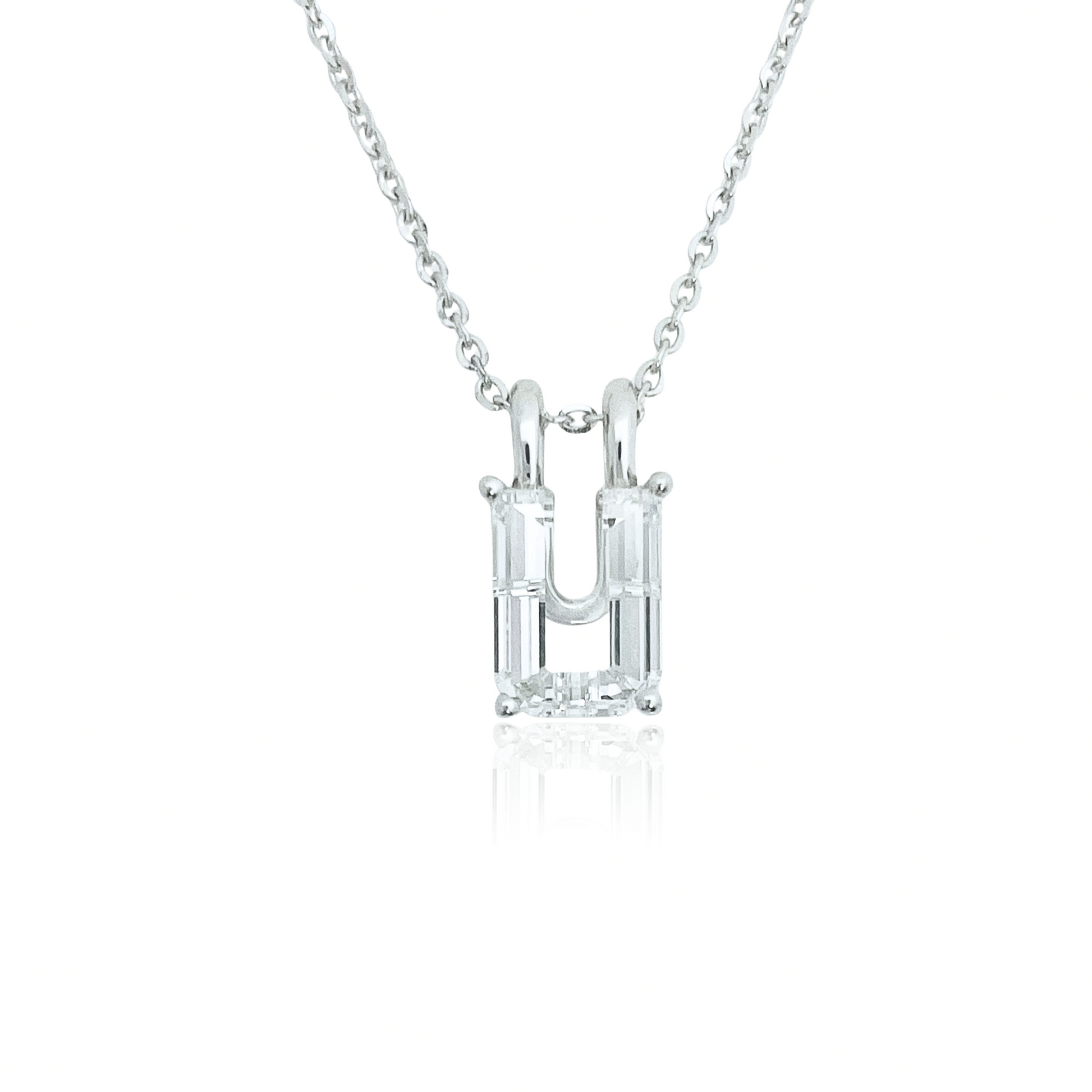 White gold necklace with a 'U' shaped diamond pendant on a white background