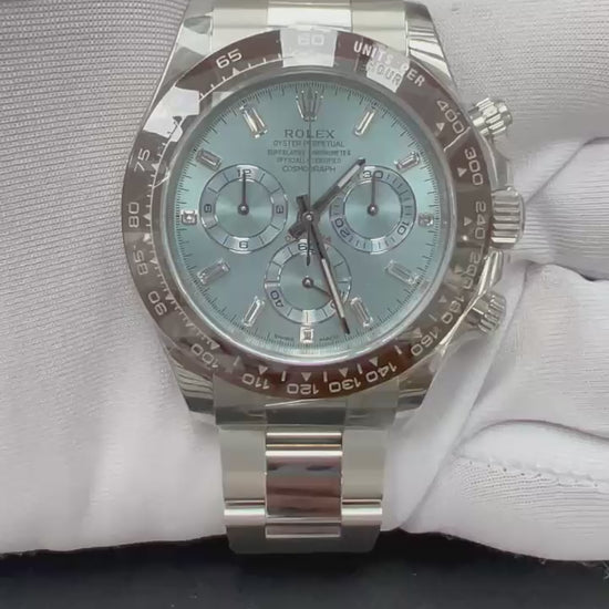 Platinum Rolex with ice blue dial being featured against a white gloved hand