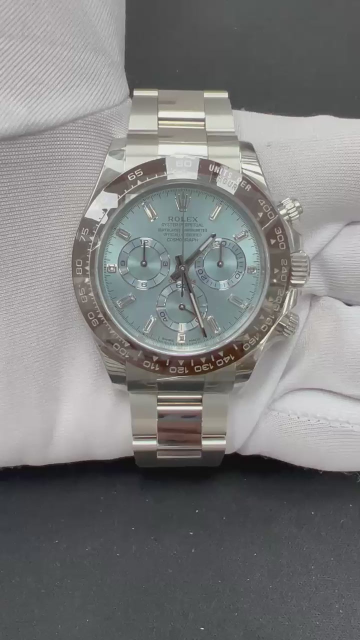 Platinum Rolex with ice blue dial being featured against a white gloved hand