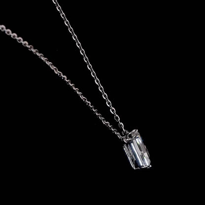 White gold necklace with an "L" shaped diamond letter pendant rotating from various angles over a dark background