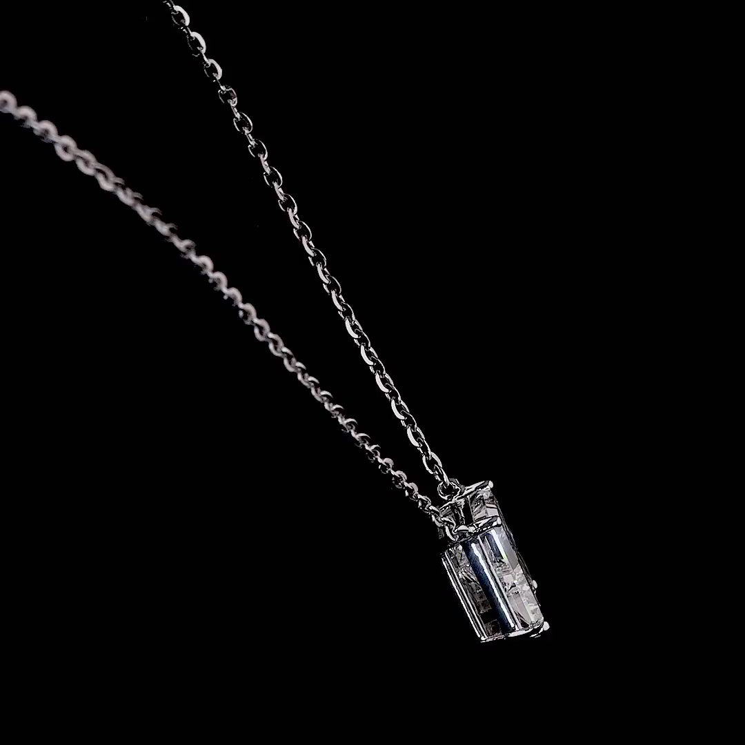 White gold necklace with an "R" shaped diamond letter pendant rotating from various angles over a dark background