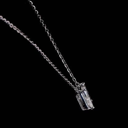 White gold necklace with an "R" shaped diamond letter pendant rotating from various angles over a dark background