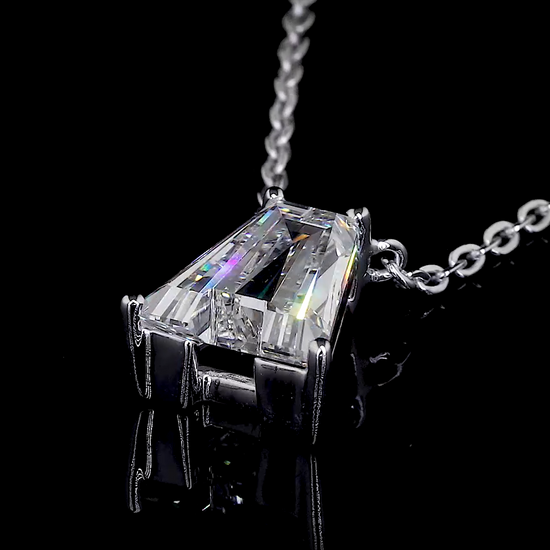 Video of a sparkling diamond letter A pendant rotating as it hangs from a white gold necklace on a black background