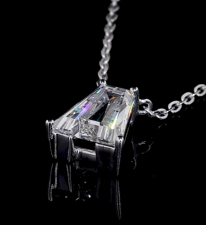 Video of a sparkling diamond letter A pendant rotating as it hangs from a white gold necklace on a black background