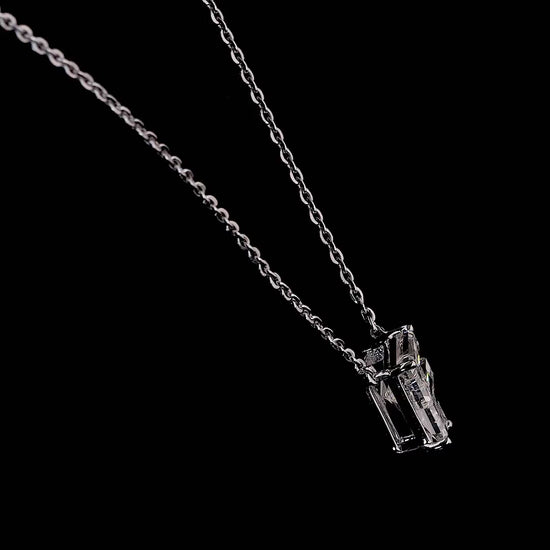 White gold necklace with a "F" shaped diamond letter pendant rotating from various angles over a dark background