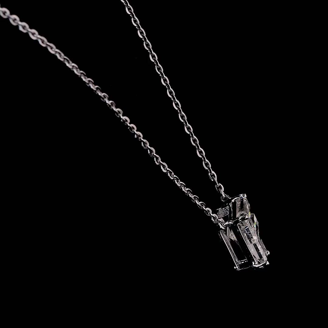 White gold necklace with a "F" shaped diamond letter pendant rotating from various angles over a dark background