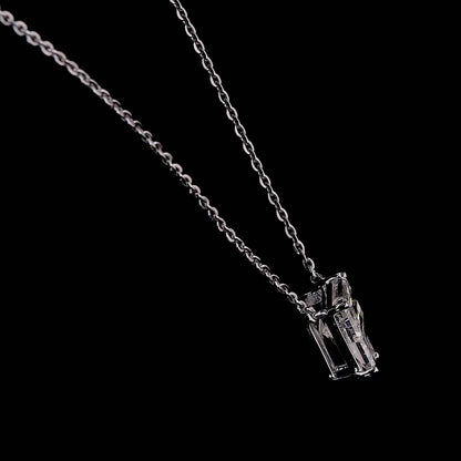 White gold necklace with a "F" shaped diamond letter pendant rotating from various angles over a dark background