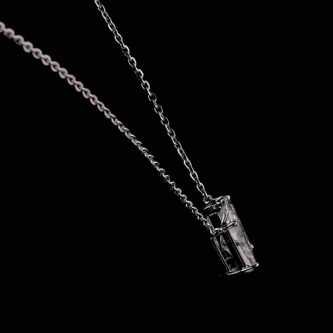 White gold necklace with a "W" shaped diamond letter pendant rotating from various angles over a dark background