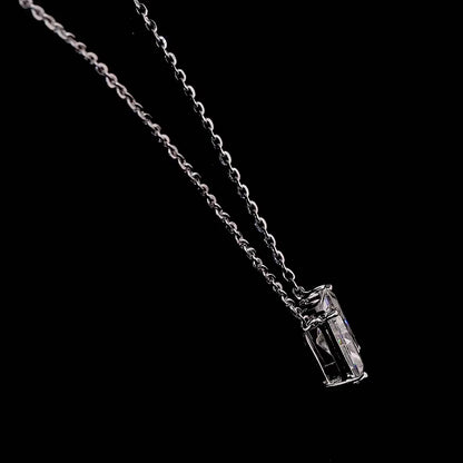 White gold necklace with an "N" shaped diamond letter pendant rotating from various angles over a dark background