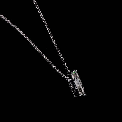 White gold necklace with a "U" shaped diamond letter pendant rotating from various angles over a dark background