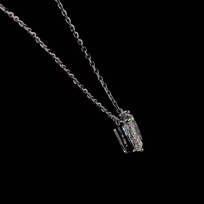 White gold necklace with a "D" shaped diamond letter pendant rotating from various angles over a dark background